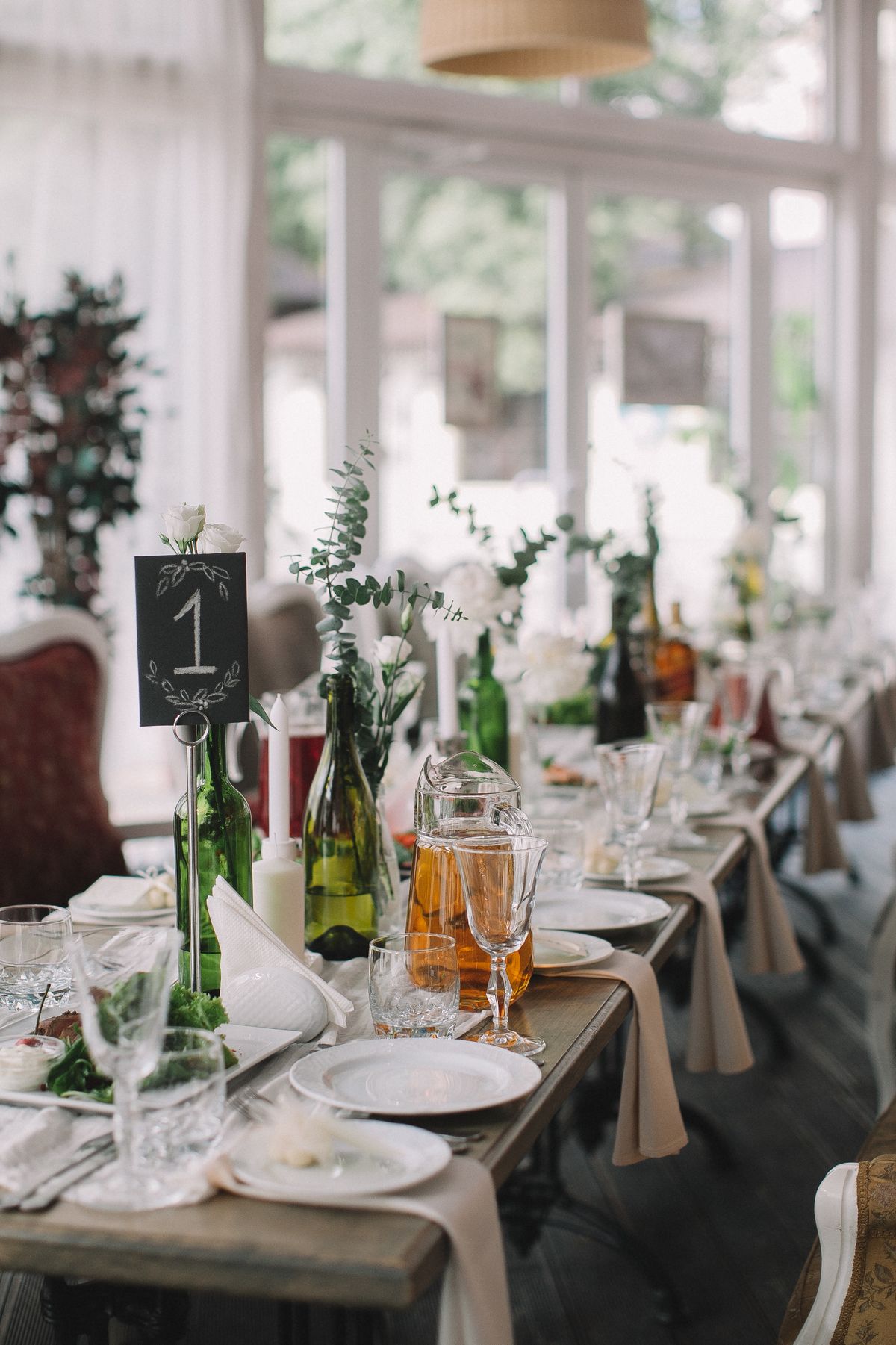 Chic dining setup with elegant tableware and floral decor